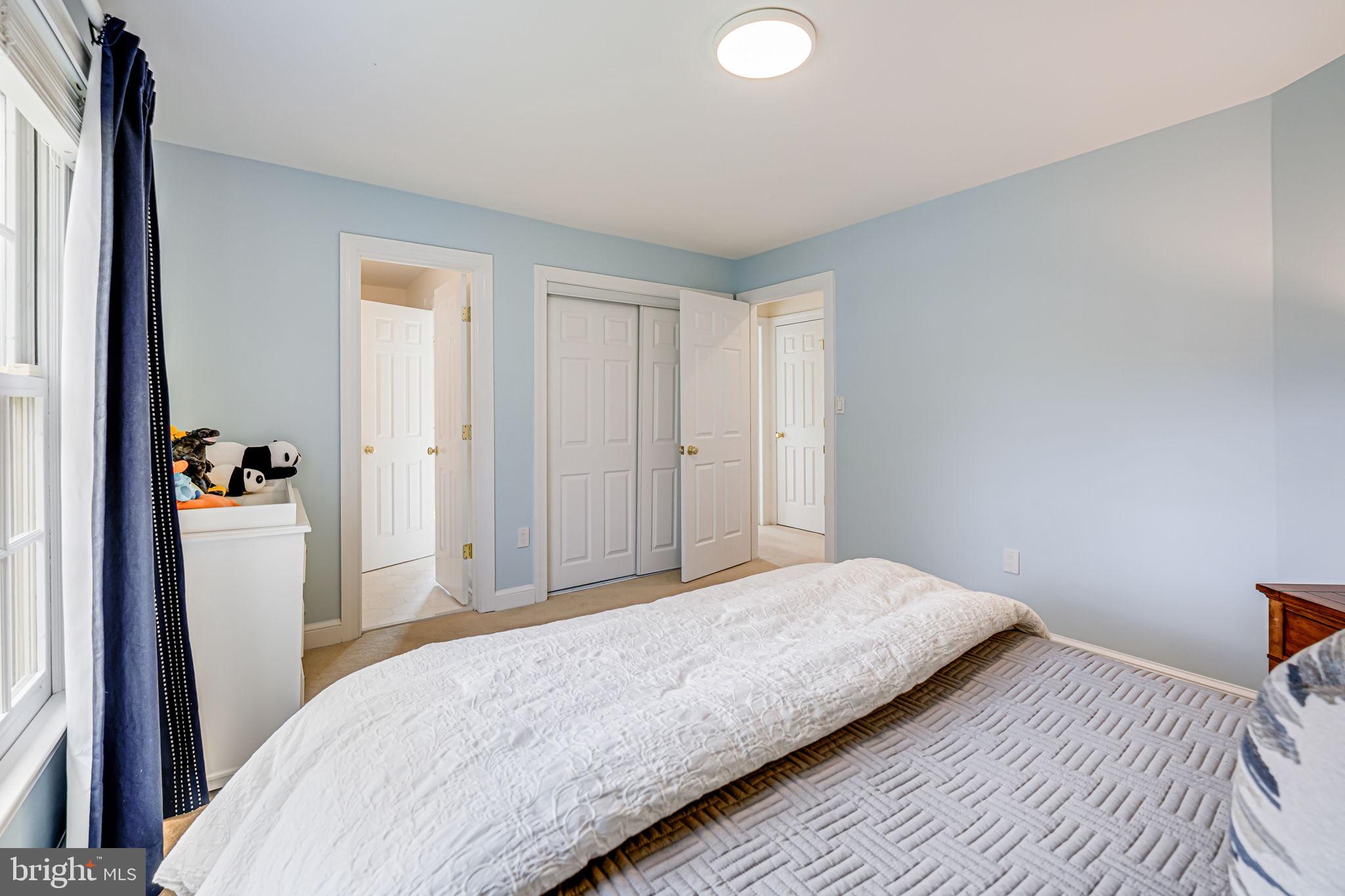 10800 Tradewind Drive Oakton, VA 22124 - Photo 47 of 77 a bedroom with a bed and a window