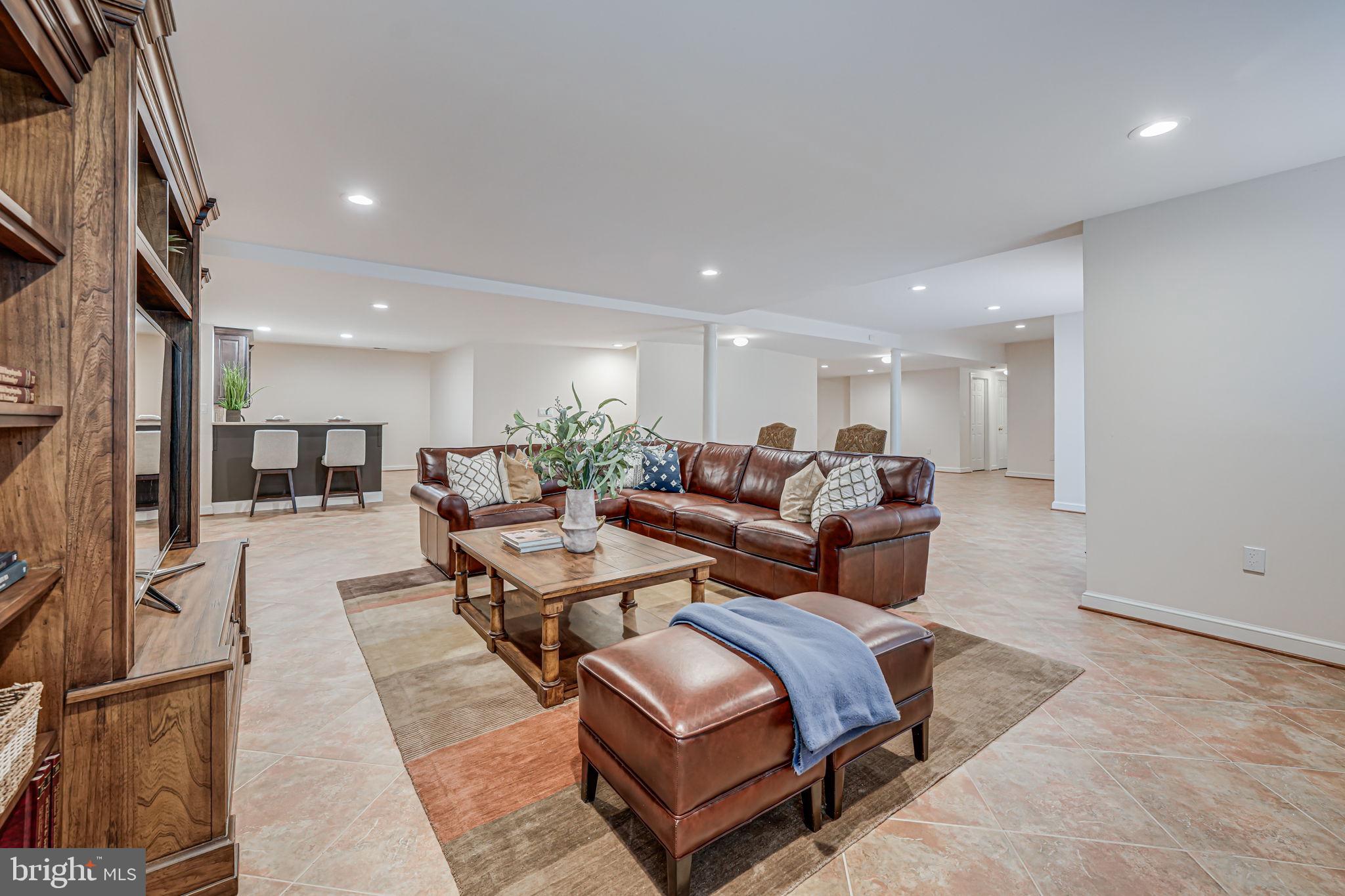 10800 Tradewind Drive Oakton, VA 22124 - Photo 52 of 77 a living room with furniture and a table