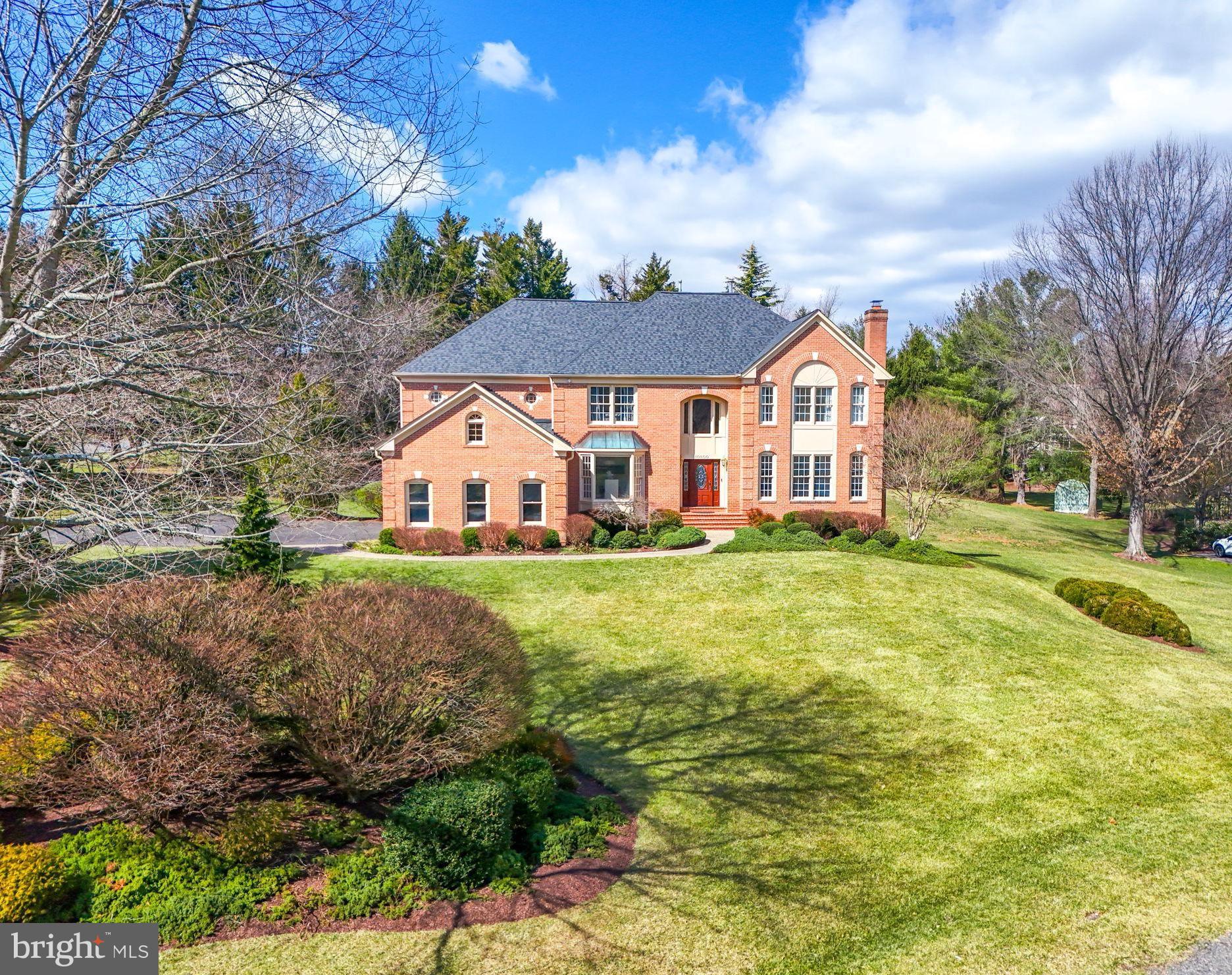 10800 Tradewind Drive Oakton, VA 22124 - Photo 70 of 77 a view of a house with a big yard and large trees
