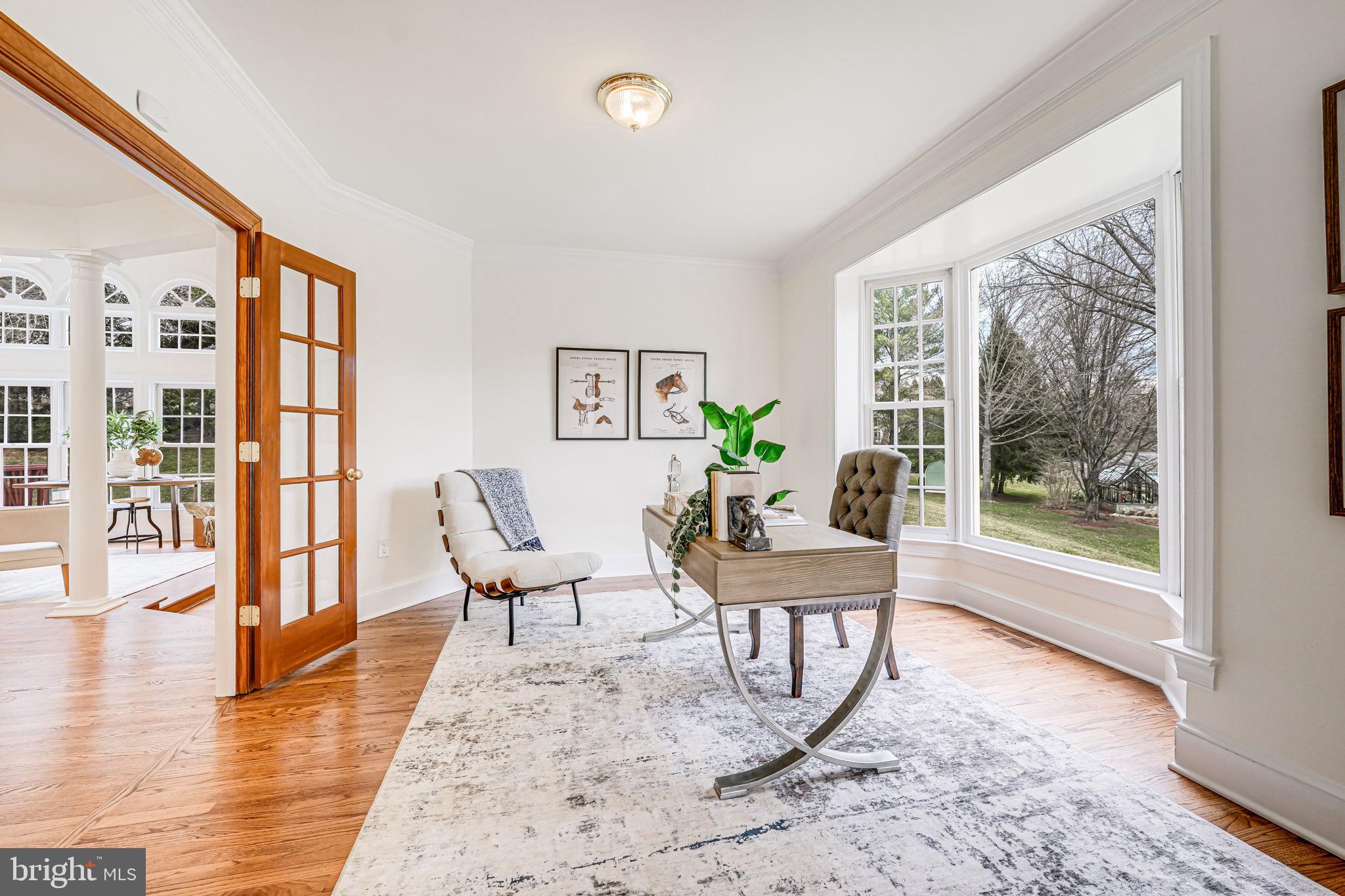 10800 Tradewind Drive Oakton, VA 22124 - Photo 10 of 77 a living room with furniture and a large window