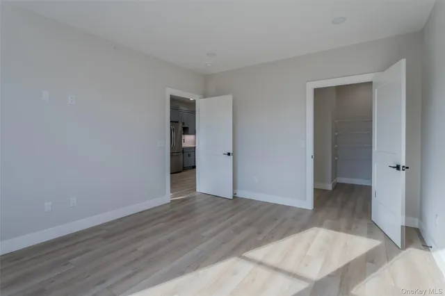 an empty room with wooden floor