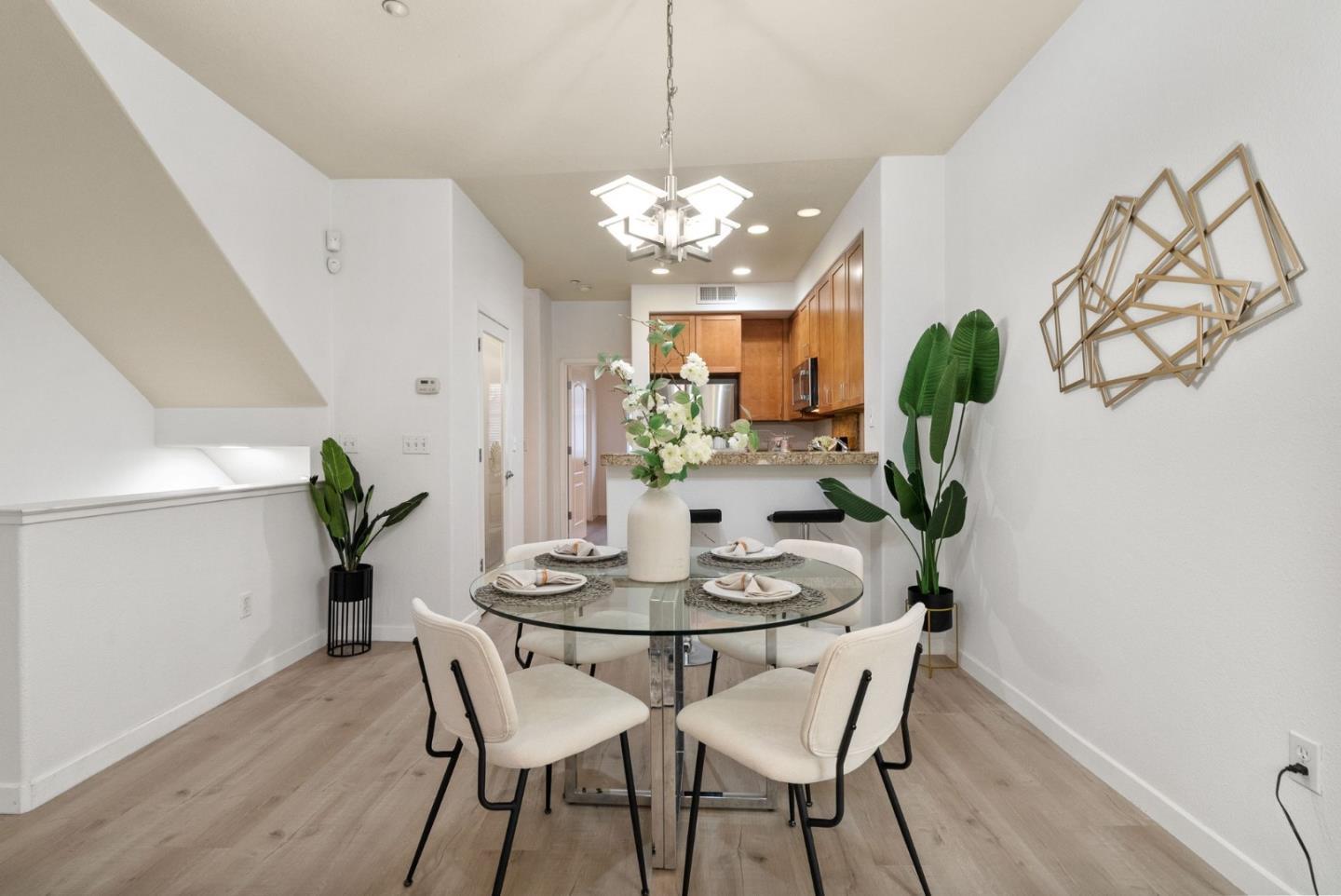 658 Kingsford Way Hayward, CA 94541 - Photo 12 of 38 a dining room with furniture and a chandelier