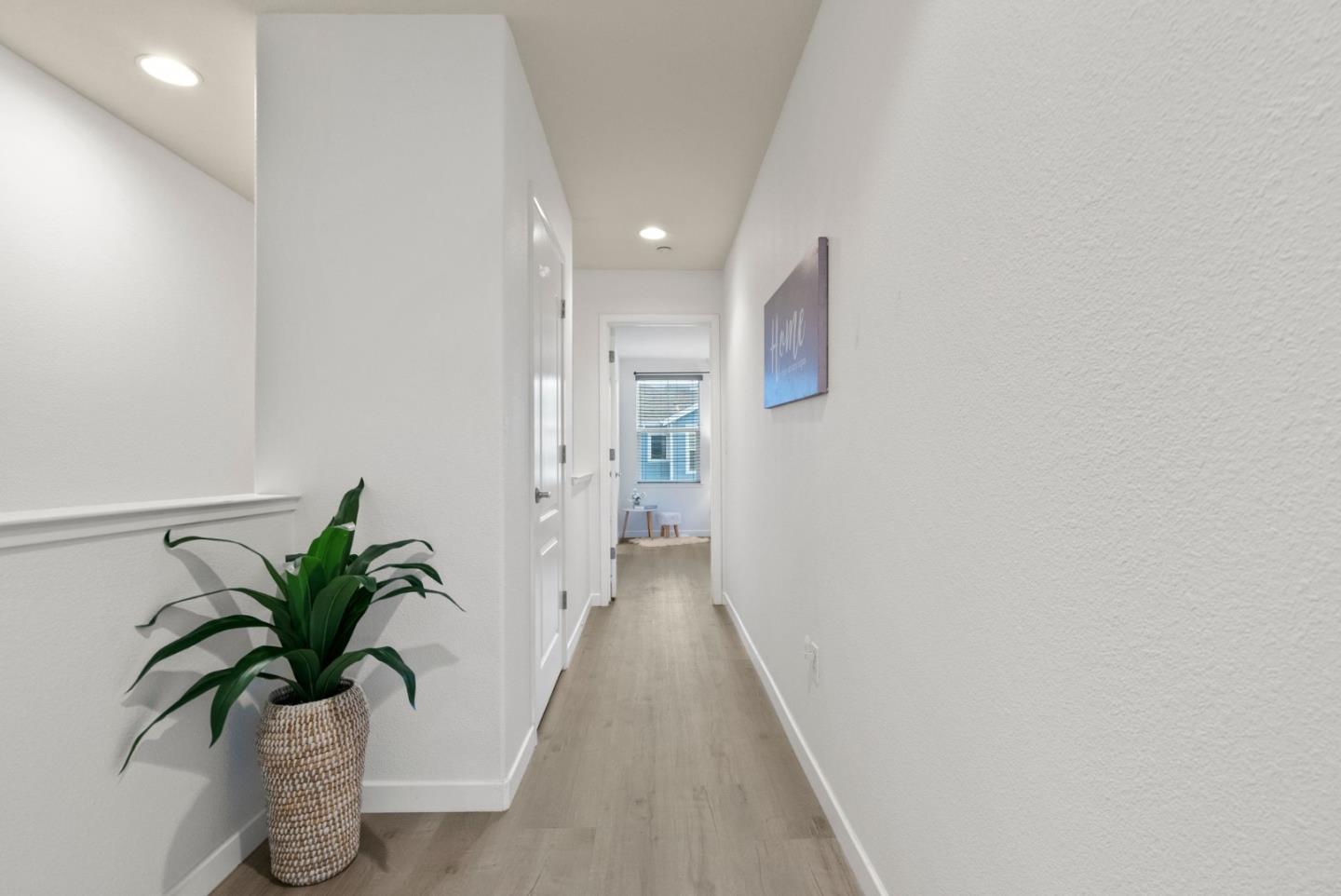 658 Kingsford Way Hayward, CA 94541 - Photo 16 of 38 a view of a hallway with potted plant