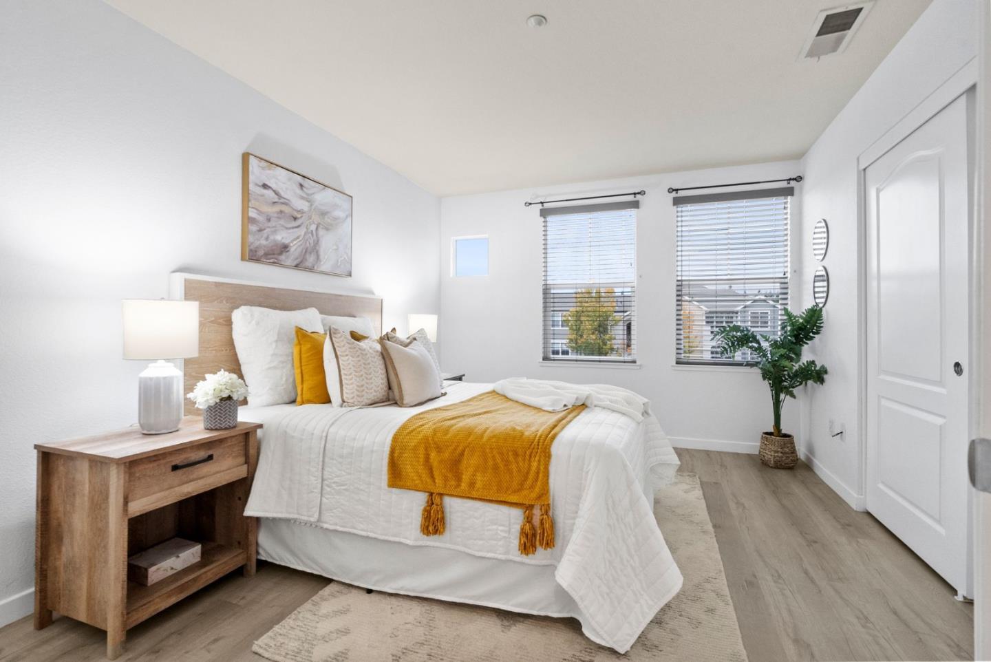 658 Kingsford Way Hayward, CA 94541 - Photo 17 of 38 a bedroom with a bed and a potted plant