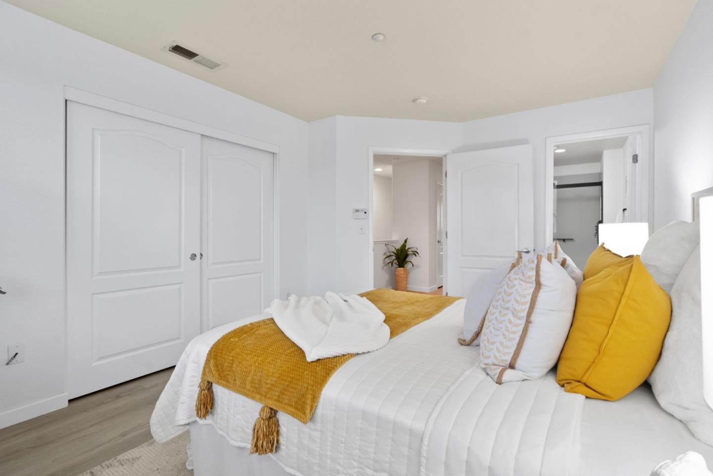 658 Kingsford Way Hayward, CA 94541 - Photo 18 of 38 a bedroom with a bed and wooden floor