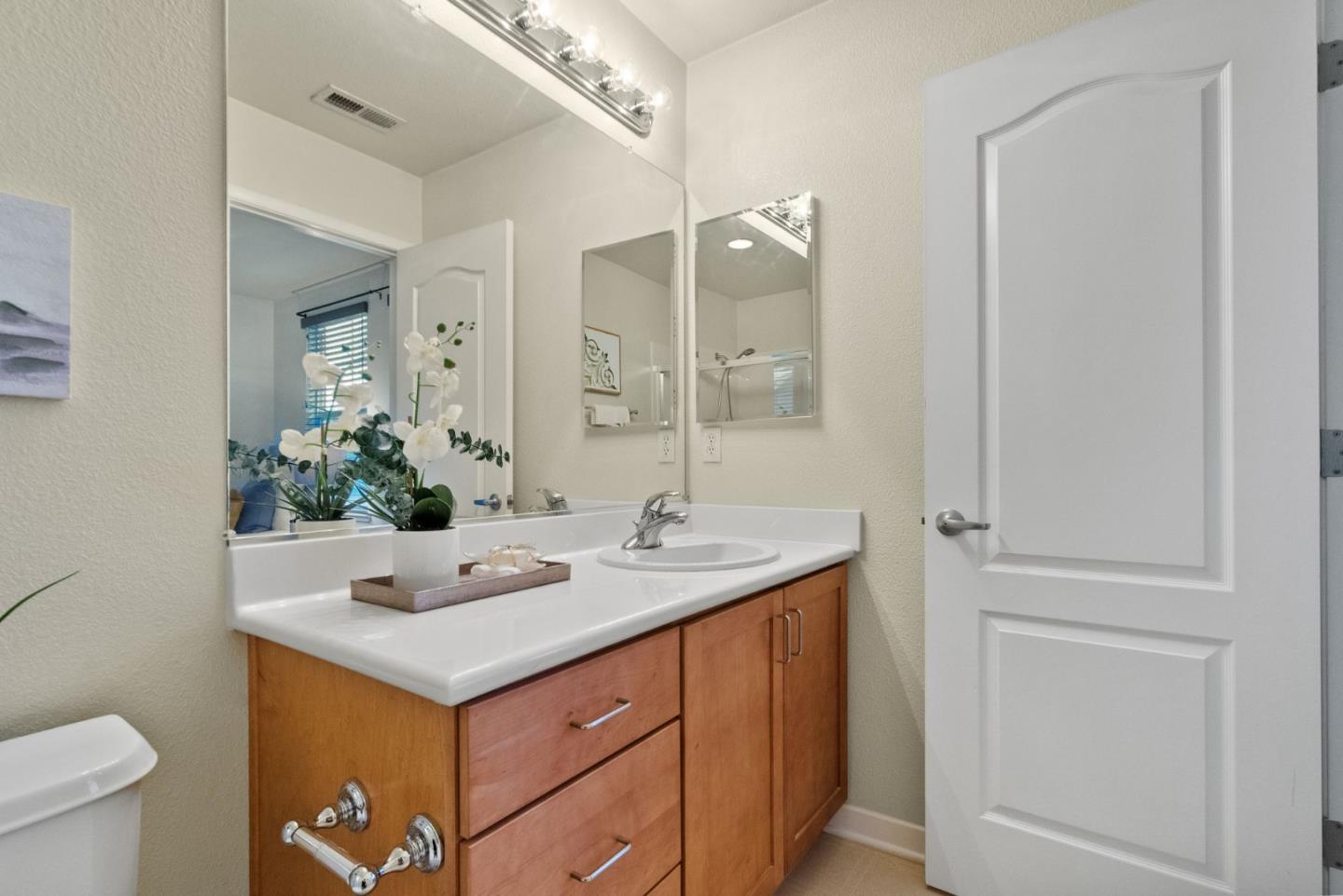 658 Kingsford Way Hayward, CA 94541 - Photo 23 of 38 a bathroom with a sink and a mirror with toilet