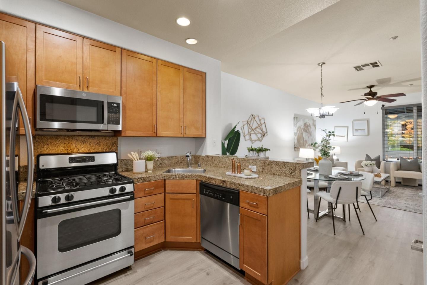 658 Kingsford Way Hayward, CA 94541 - Photo 8 of 38 a kitchen with a stove a sink and a microwave