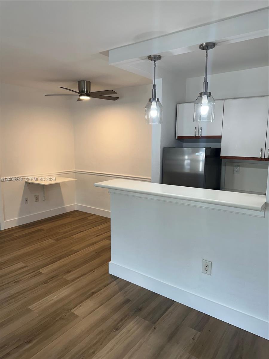 6310 Southwest 79th Street, Unit 1 South Miami, FL 33143 - Photo 7 of 8 a view of a room with wooden floor