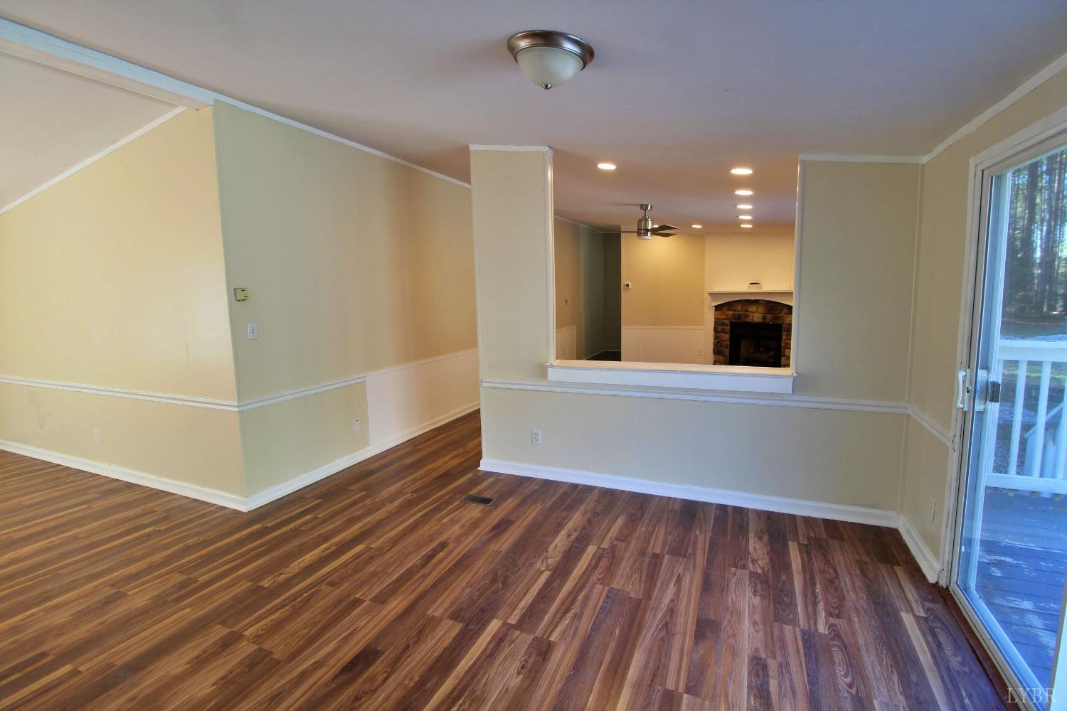 1908 Holiday Lake Road Appomattox, VA 24522 - Photo 11 of 35 wooden floor in an empty room with a window