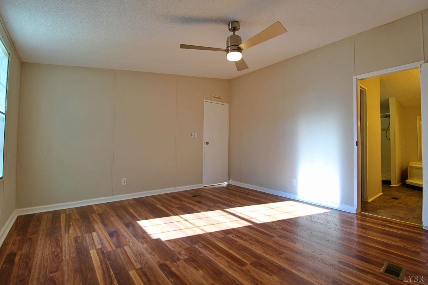 1908 Holiday Lake Road Appomattox, VA 24522 - Photo 15 of 35 a view of wooden floor in a room