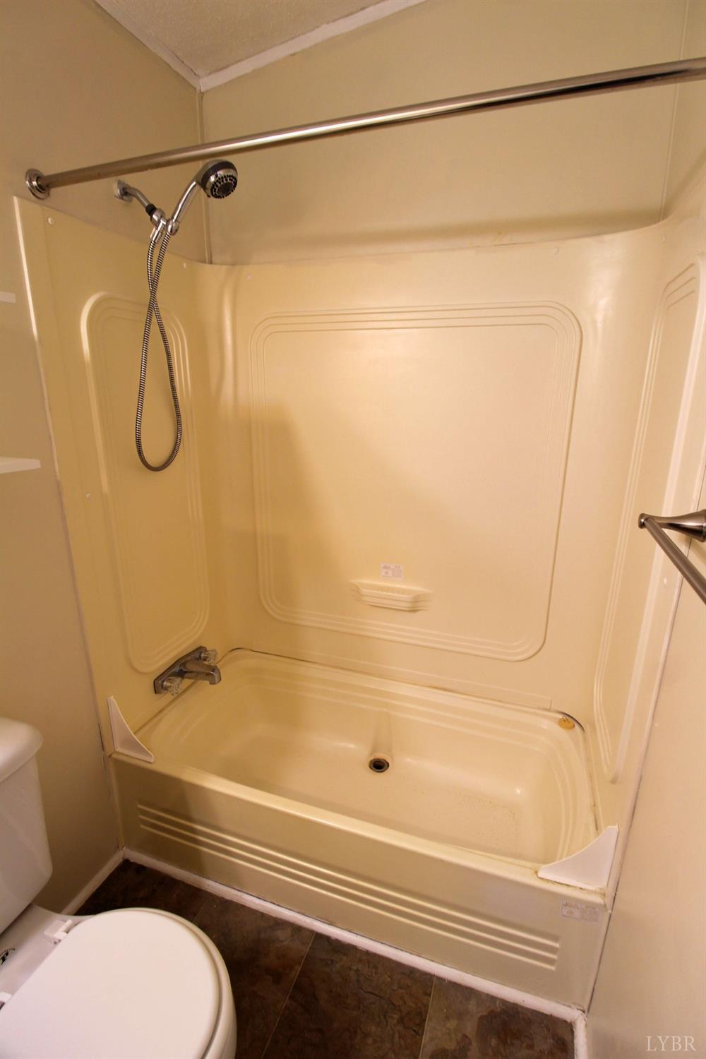 1908 Holiday Lake Road Appomattox, VA 24522 - Photo 24 of 35 a bathroom with a shower and a toilet