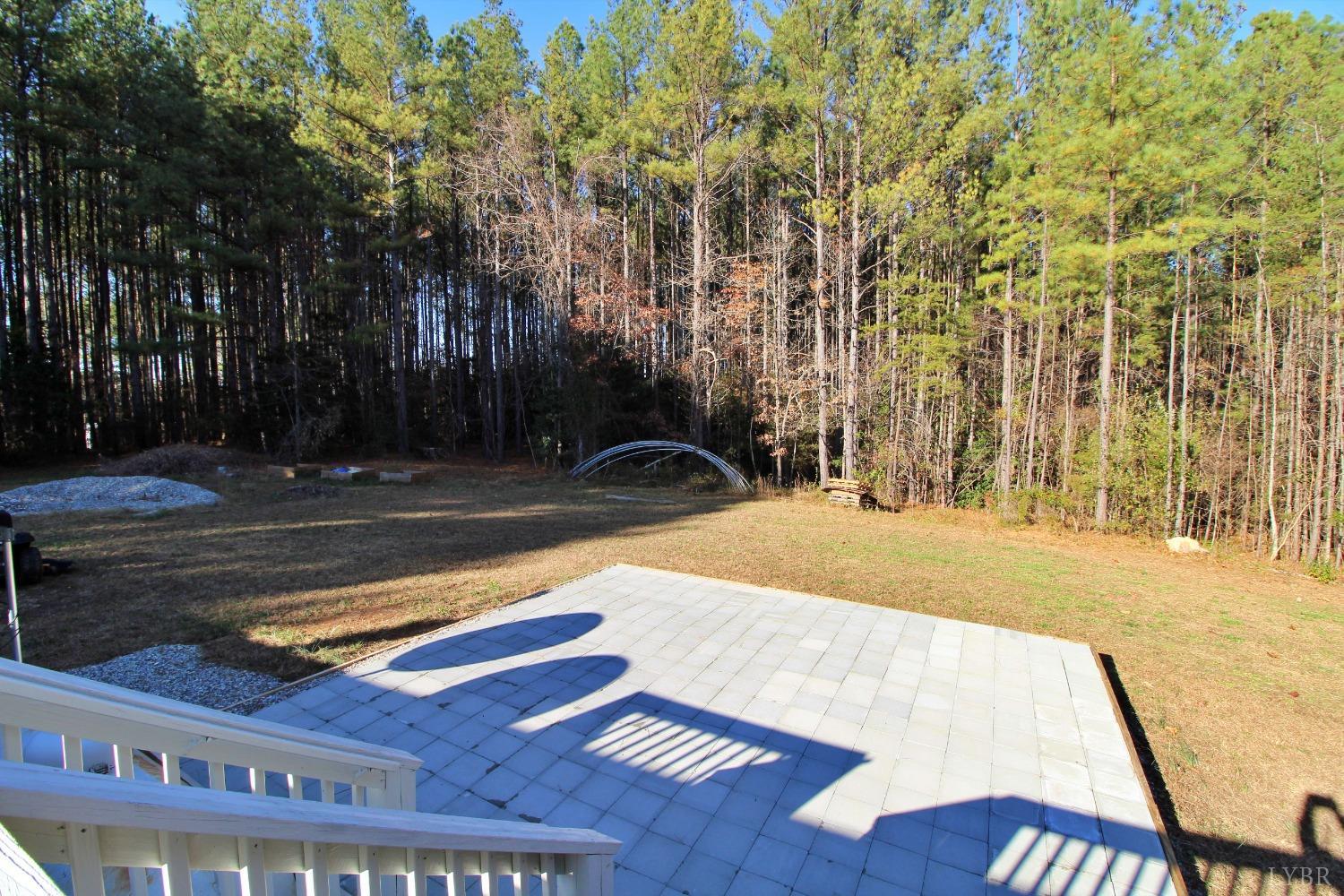 1908 Holiday Lake Road Appomattox, VA 24522 - Photo 27 of 35 a view of yard with swimming pool and trees