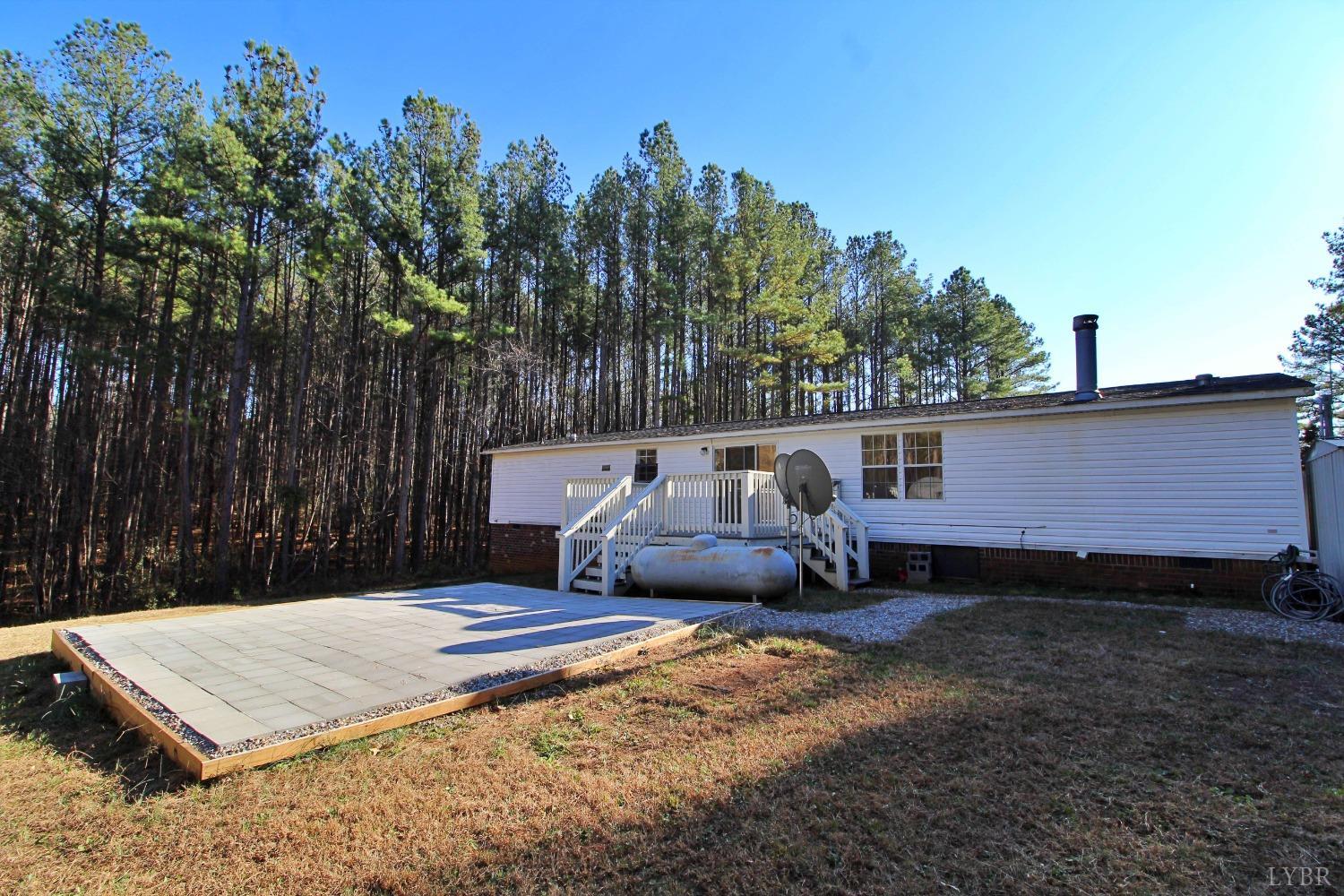 1908 Holiday Lake Road Appomattox, VA 24522 - Photo 28 of 35 a backyard of a house with table and chairs