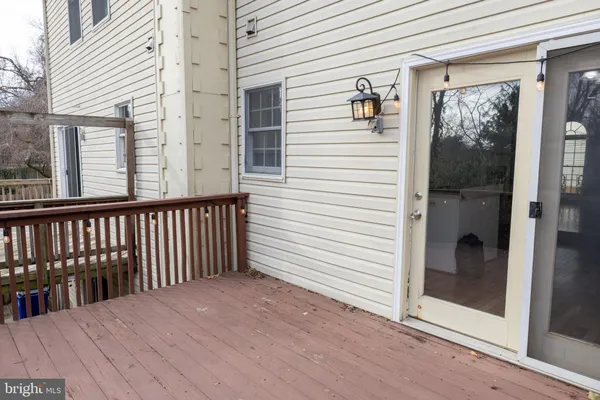 a view of a balcony with wooden floor