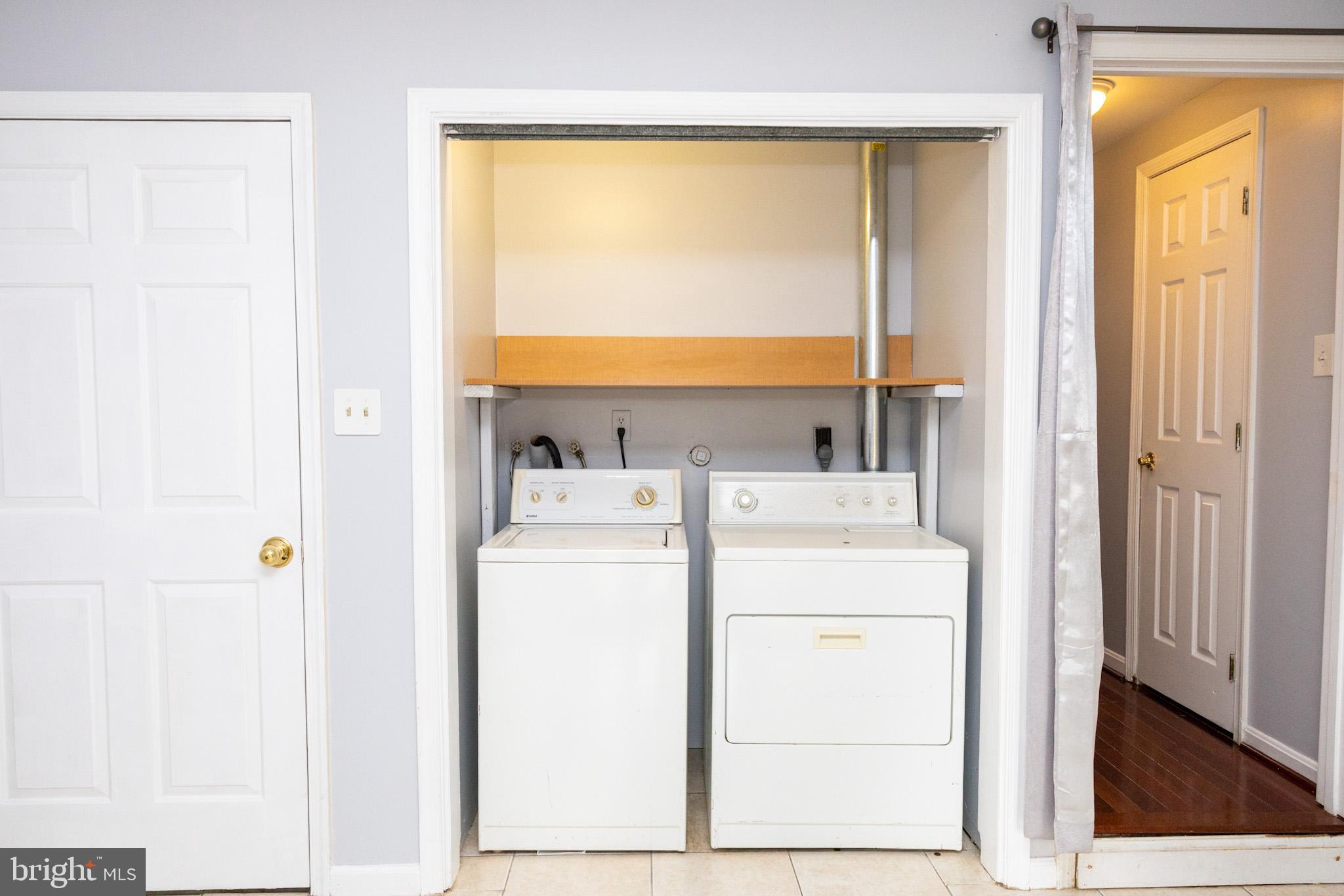 58 Victoria Square Frederick, MD 21702 - Photo 23 of 26 a utility room with dryer and washer