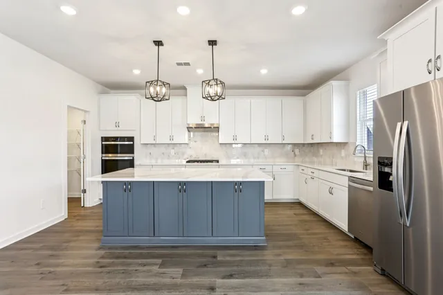 a kitchen with a sink and cabinets