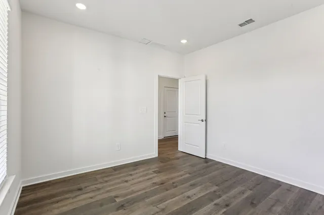 a bathroom with a sink vanity mirror and toilet