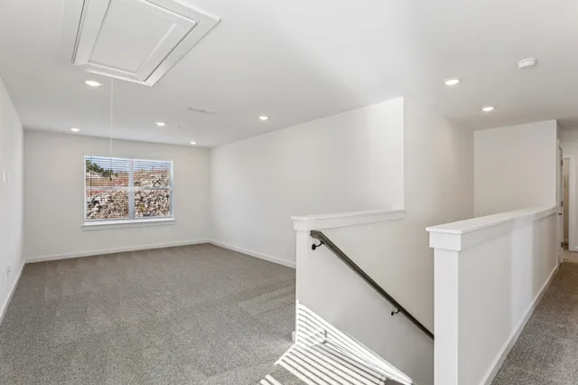 a view of a hallway with windows