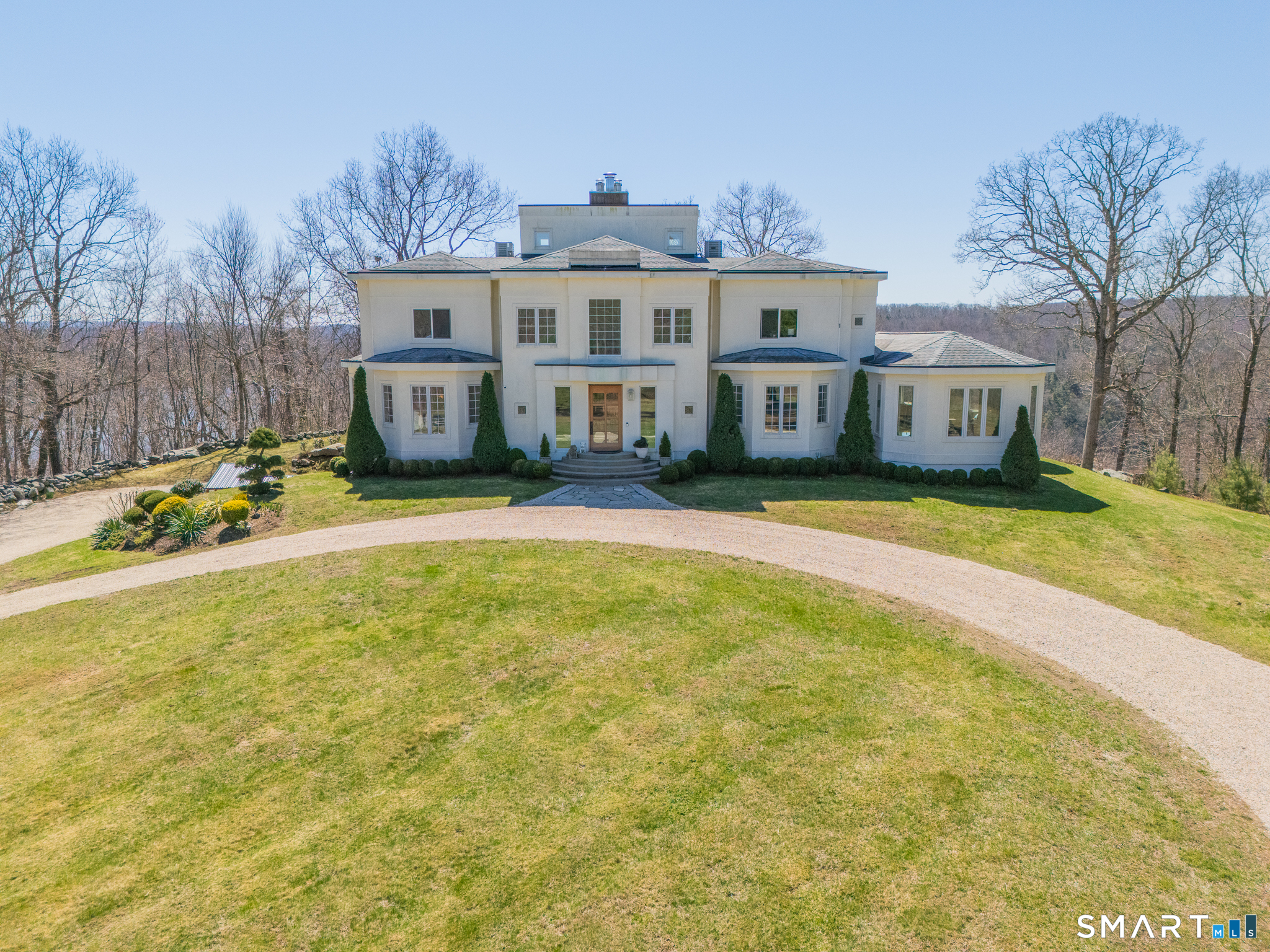 a view of a house with pool and a yard