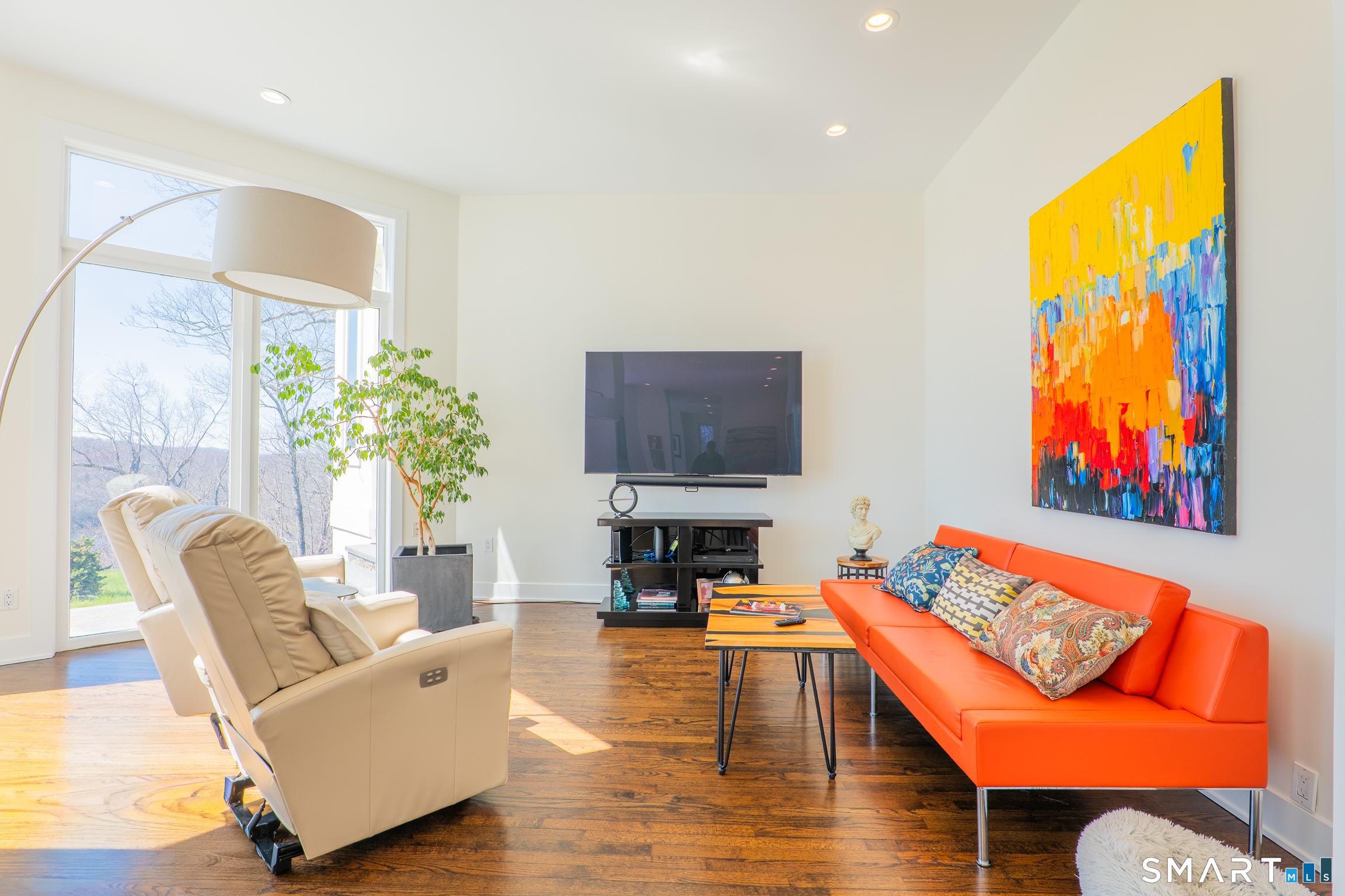 216 Kuhne Road Southbury, CT 06488 - Photo 12 of 40 a living room with furniture and a flat screen tv