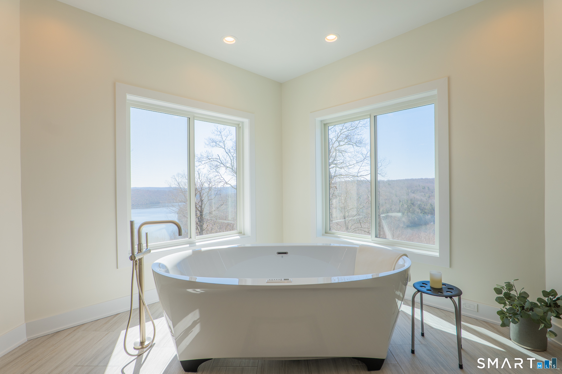 216 Kuhne Road Southbury, CT 06488 - Photo 19 of 40 a white bath tub sitting in a bathroom next to a window