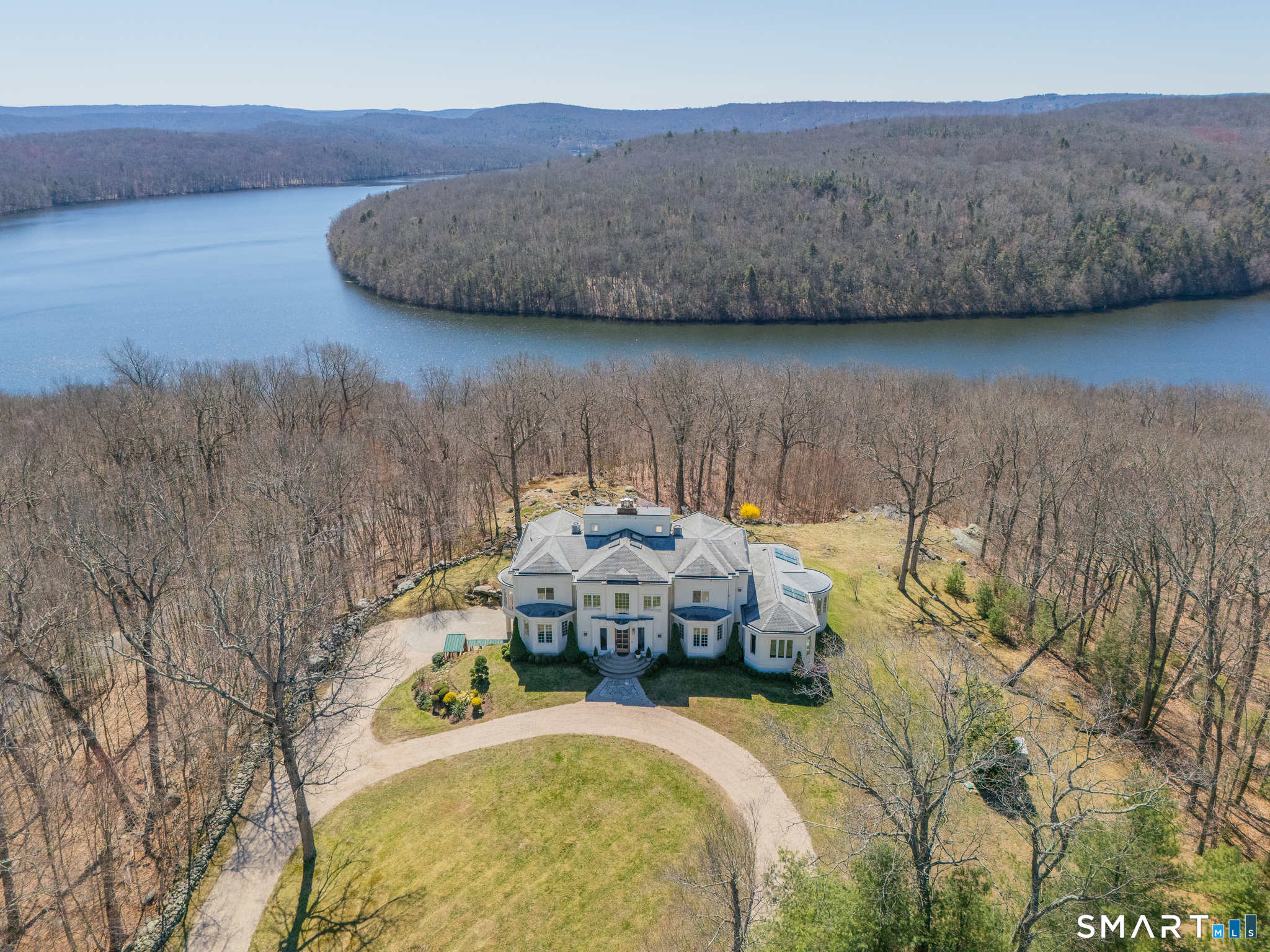 216 Kuhne Road Southbury, CT 06488 - Photo 2 of 40 a bed sitting in a bedroom next to a lamp