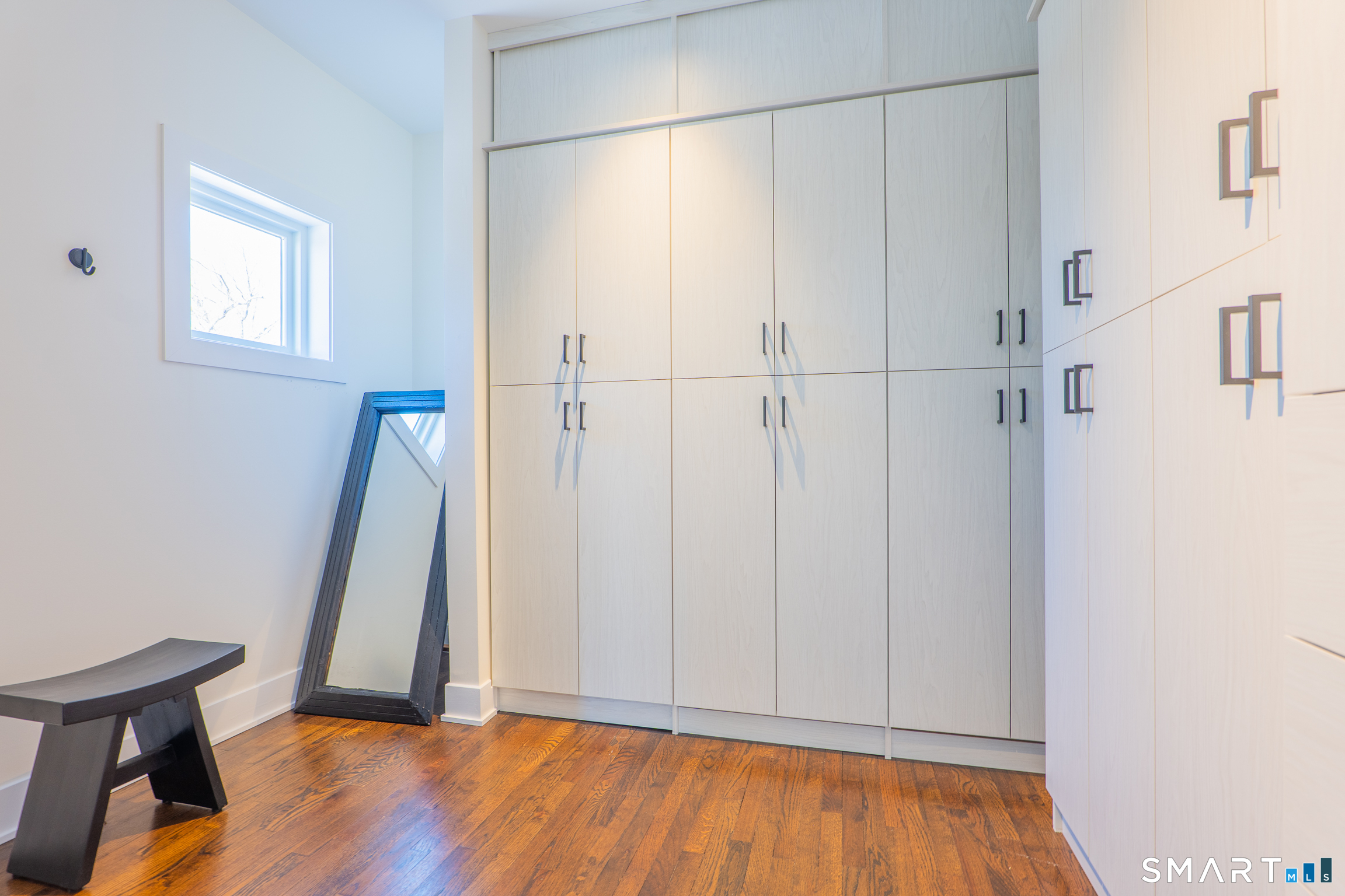 216 Kuhne Road Southbury, CT 06488 - Photo 22 of 40 a view of an empty room with wooden floor and a window
