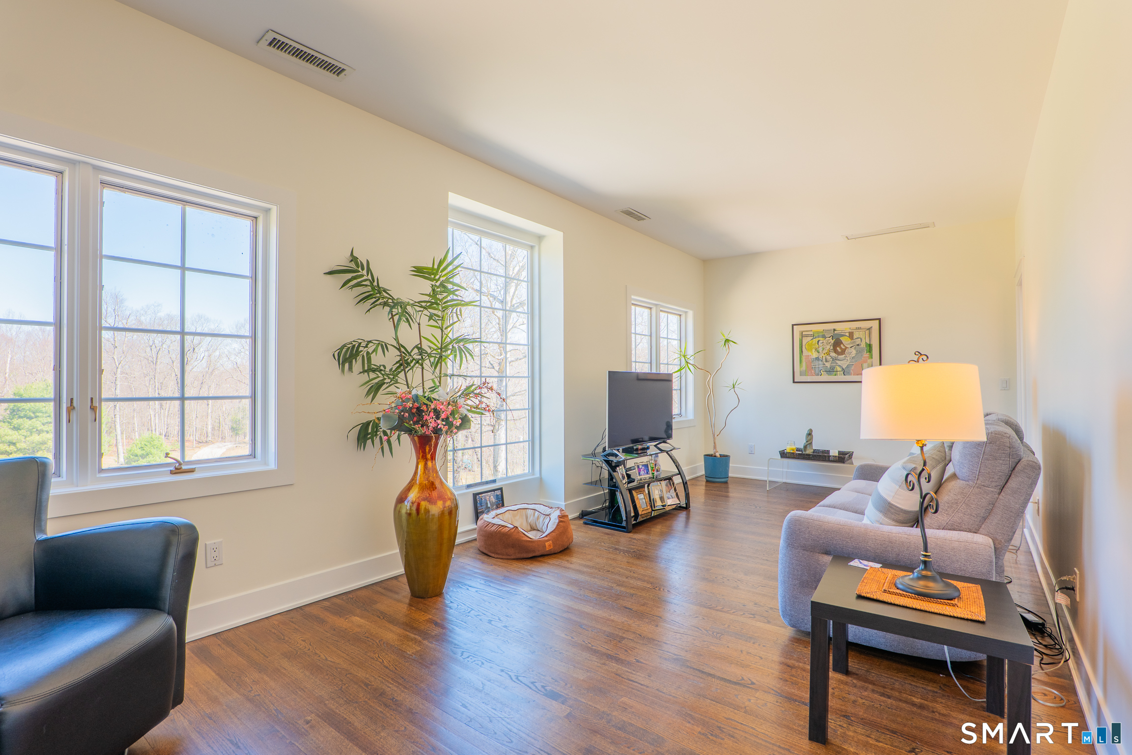 216 Kuhne Road Southbury, CT 06488 - Photo 23 of 40 a living room filled with furniture and wooden floor
