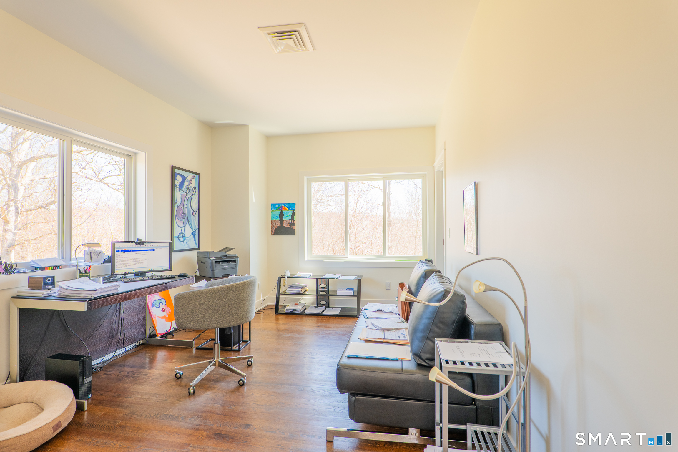 216 Kuhne Road Southbury, CT 06488 - Photo 24 of 40 a living room with furniture a wooden floor and a large window