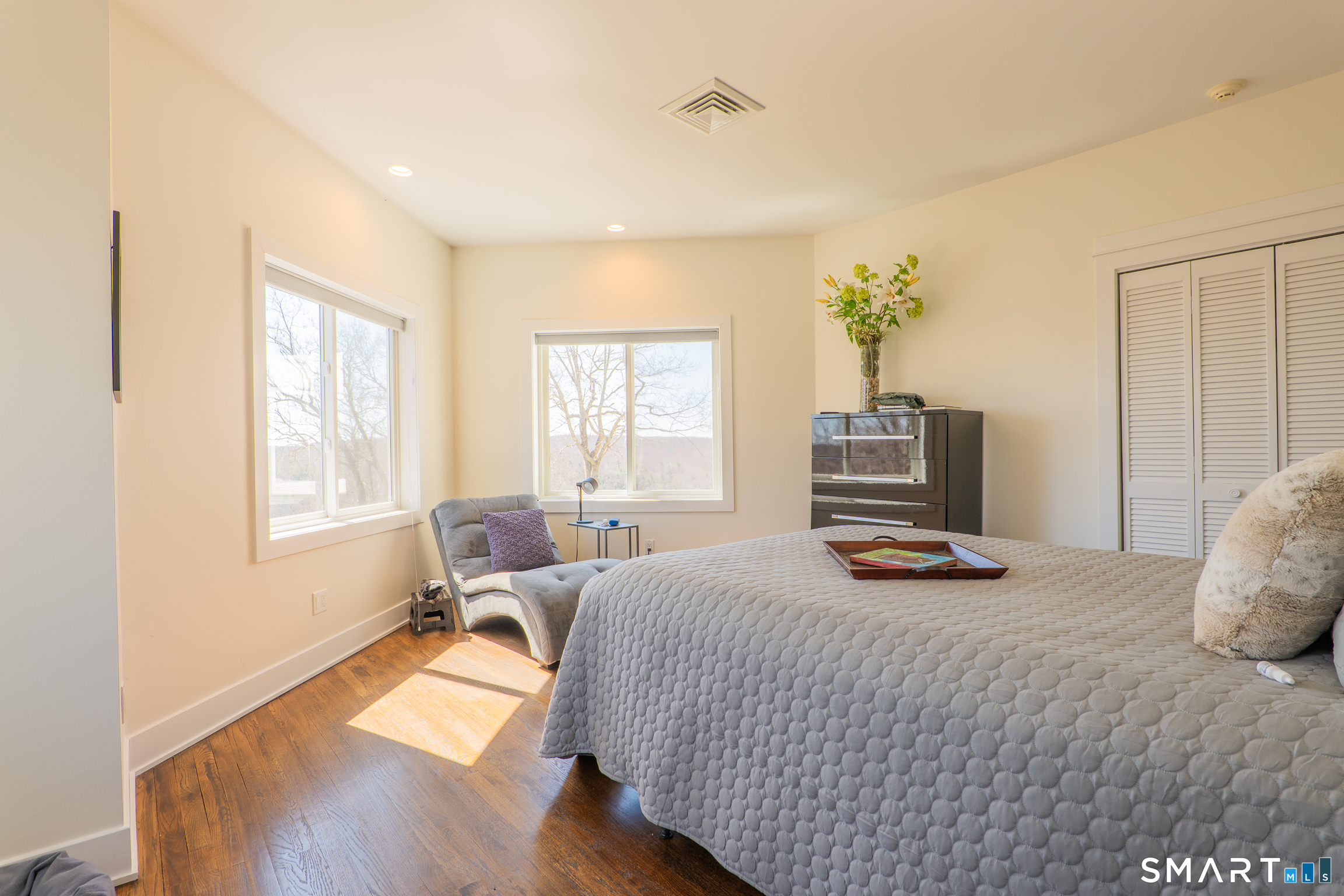 216 Kuhne Road Southbury, CT 06488 - Photo 26 of 40 a bedroom with a bed and wooden floor