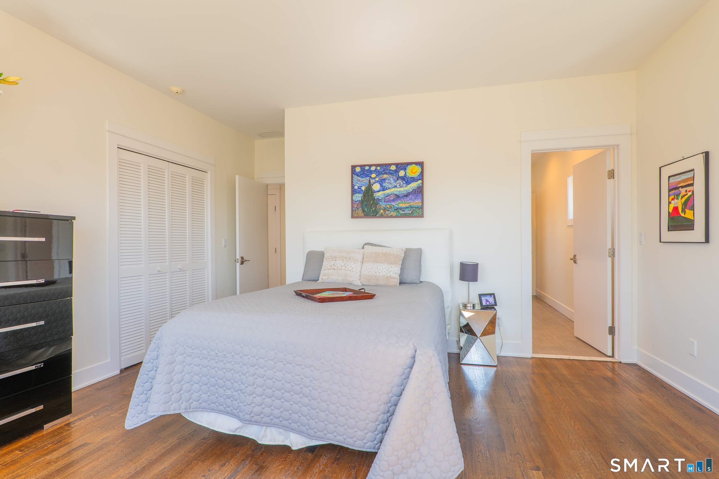 216 Kuhne Road Southbury, CT 06488 - Photo 27 of 40 a bedroom with a bed and wooden floor