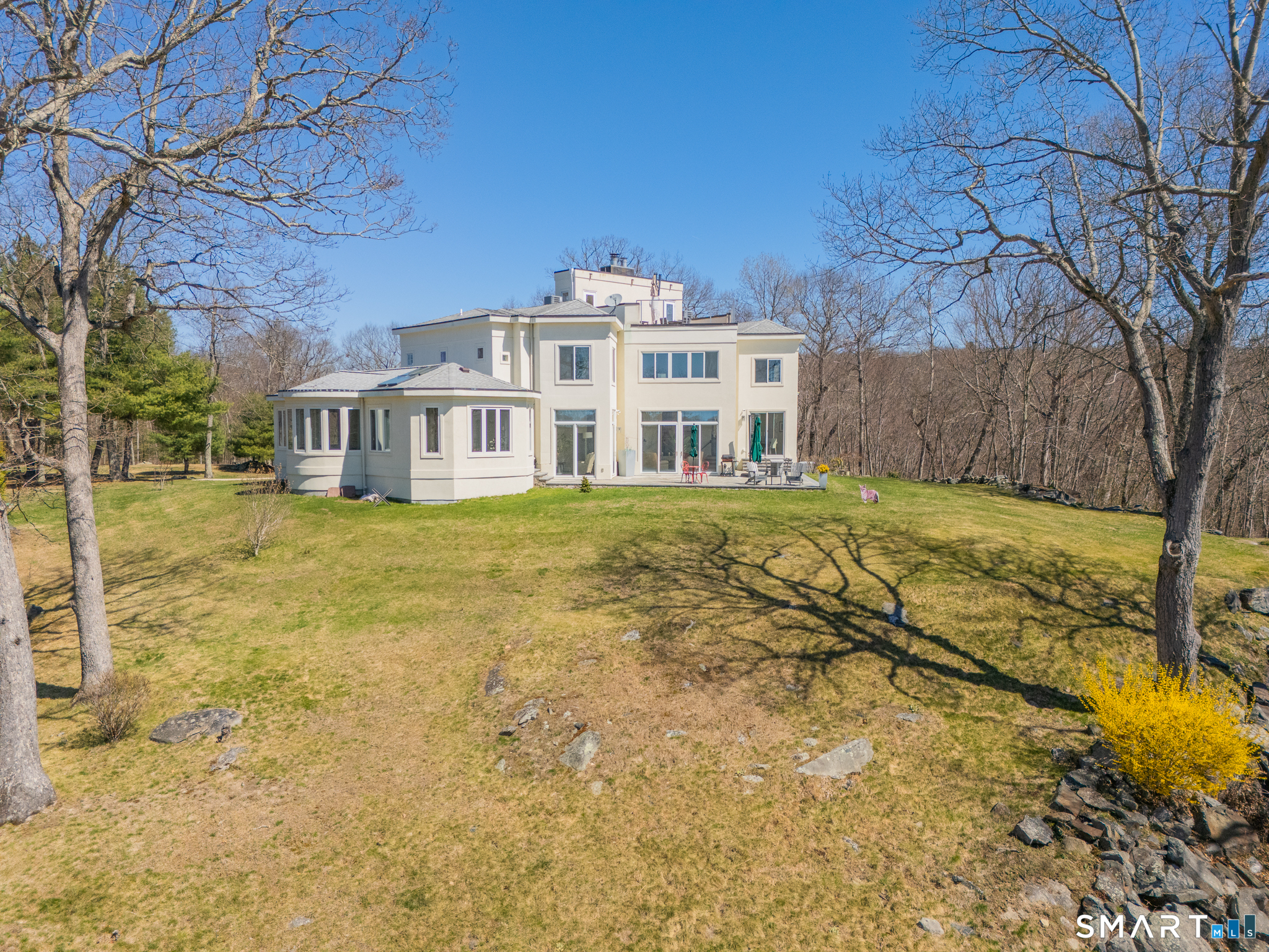 216 Kuhne Road Southbury, CT 06488 - Photo 36 of 40 a view of a building with a yard