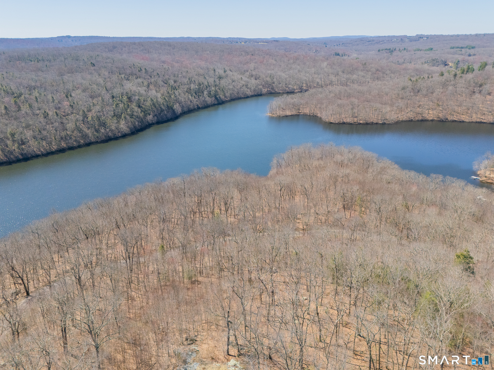 216 Kuhne Road Southbury, CT 06488 - Photo 37 of 40 a view of wooden floor and lake in the background