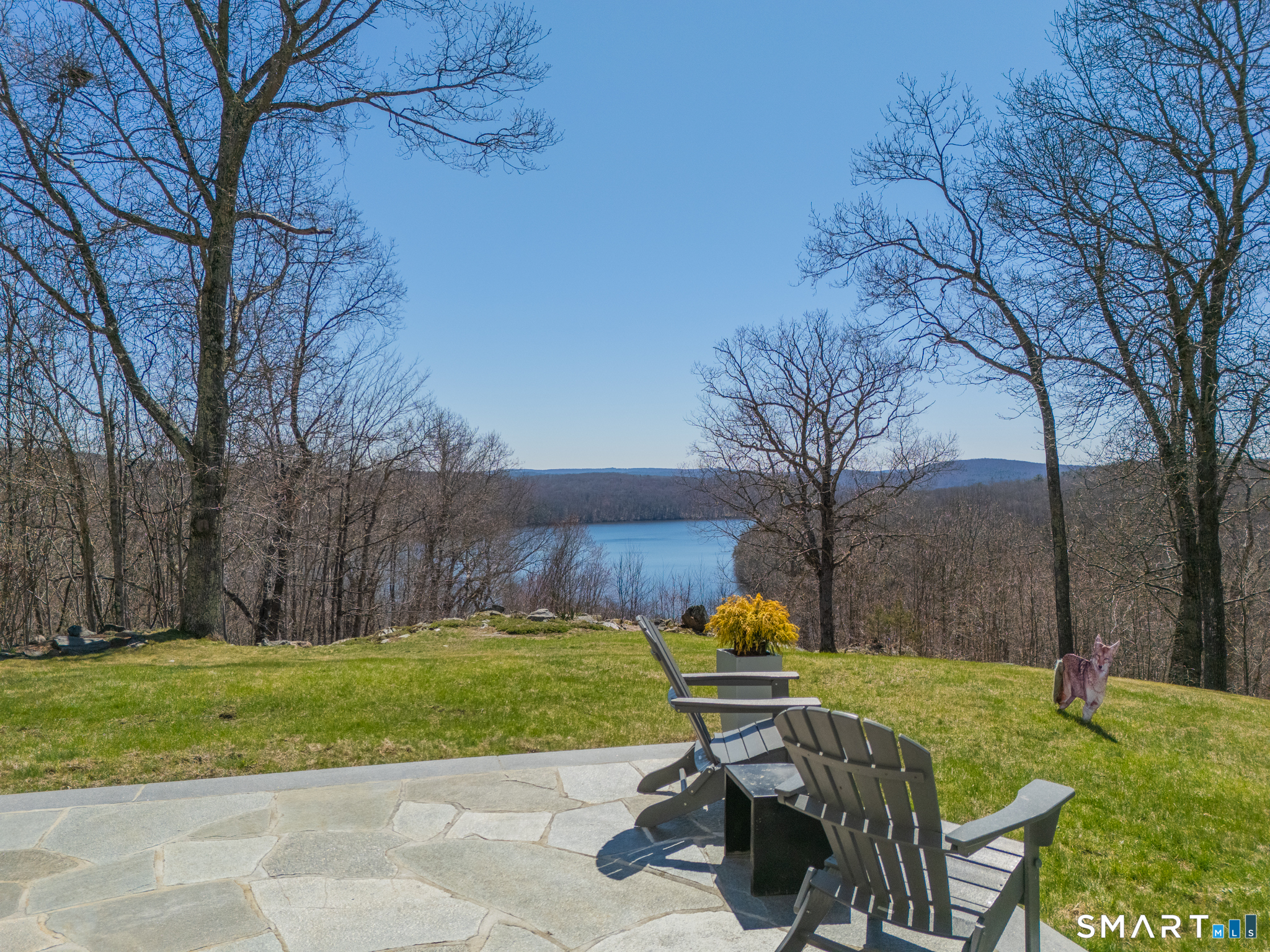 216 Kuhne Road Southbury, CT 06488 - Photo 4 of 40 a view of backyard with seating area and trees