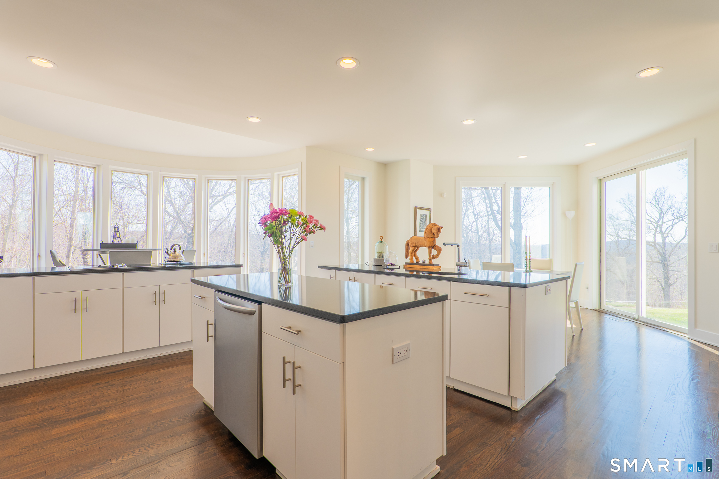 216 Kuhne Road Southbury, CT 06488 - Photo 5 of 40 a kitchen with white cabinets and sink