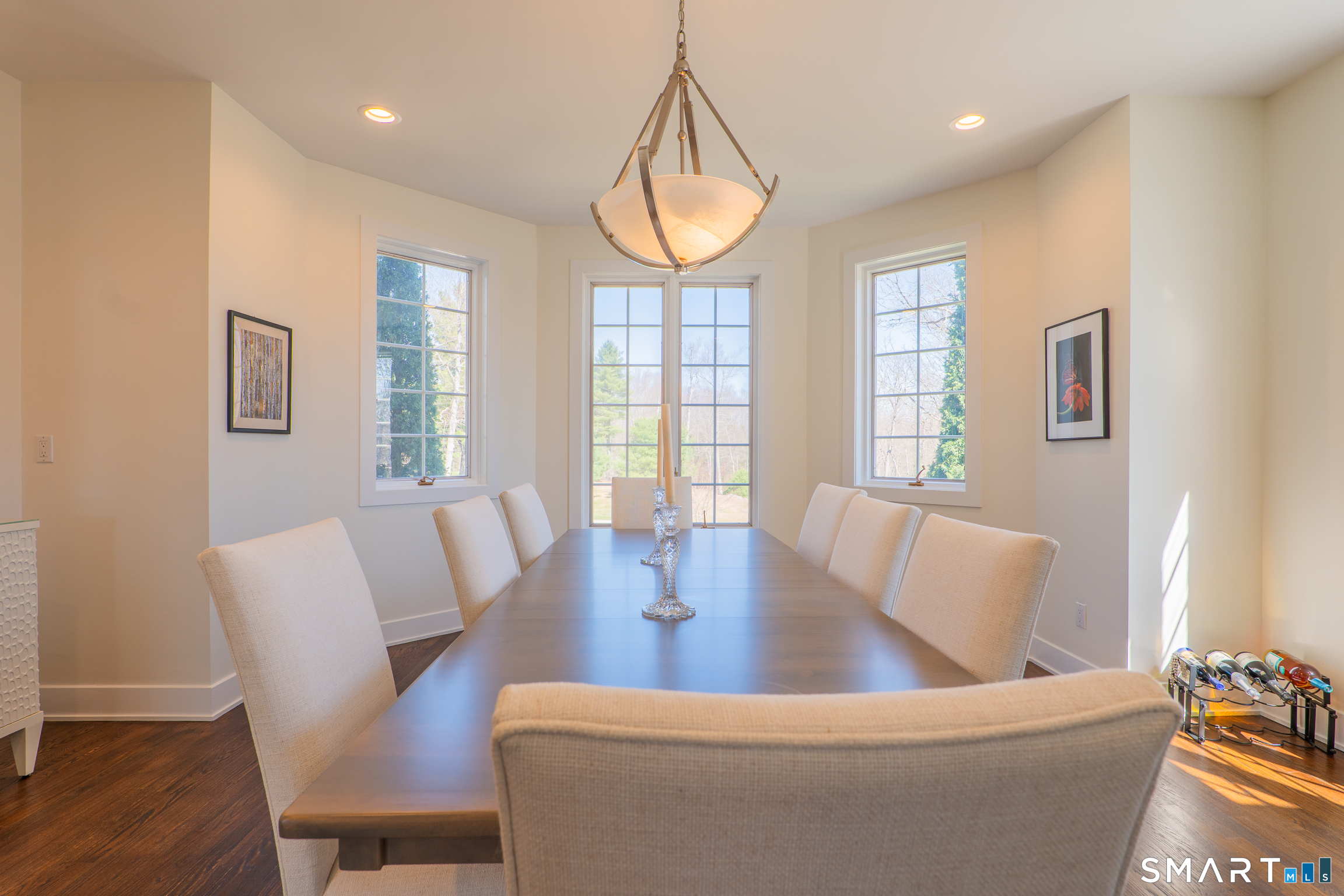 216 Kuhne Road Southbury, CT 06488 - Photo 9 of 40 a view of a dining room with furniture wooden floor and a chandelier