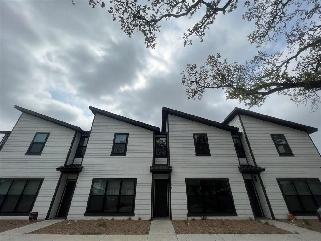 794 Pecan, Unit 102 Stephenville, TX 76401 - Photo 1 of 1 a front view of a house with a yard
