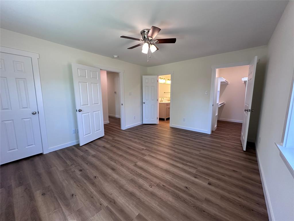 706 Barbara Street Athens, TX 75751 - Photo 8 of 13 wooden floor in an empty room with a window