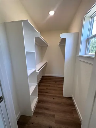a view of entryway with wooden floor and stairs