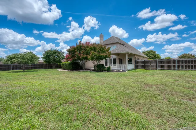 a view of a house with a big yard