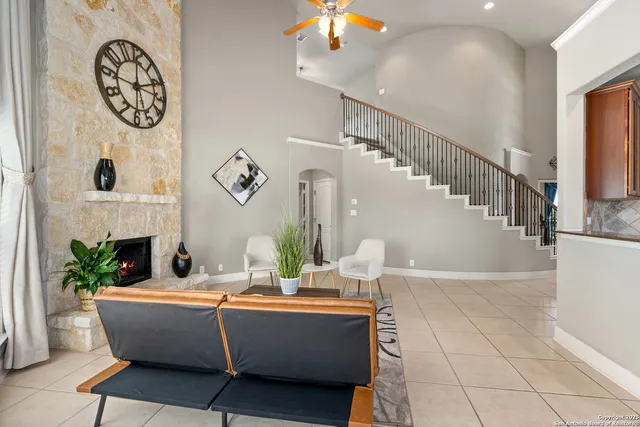 a living room with furniture and a fireplace