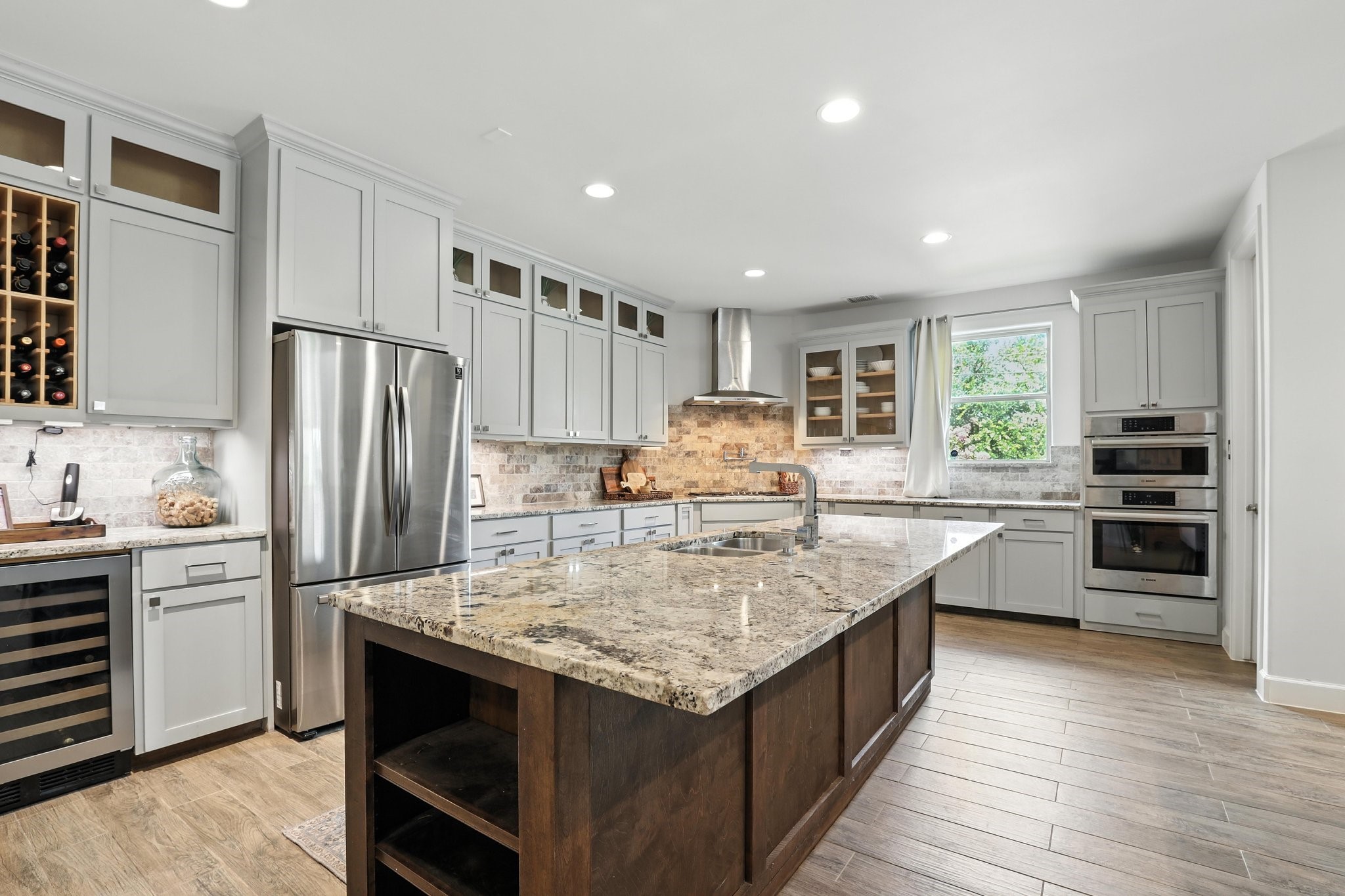 3202 Ozark Street Houston, TX 77021 - Photo 14 of 37 a kitchen with stainless steel appliances granite countertop a kitchen island a stove a refrigerator and a sink