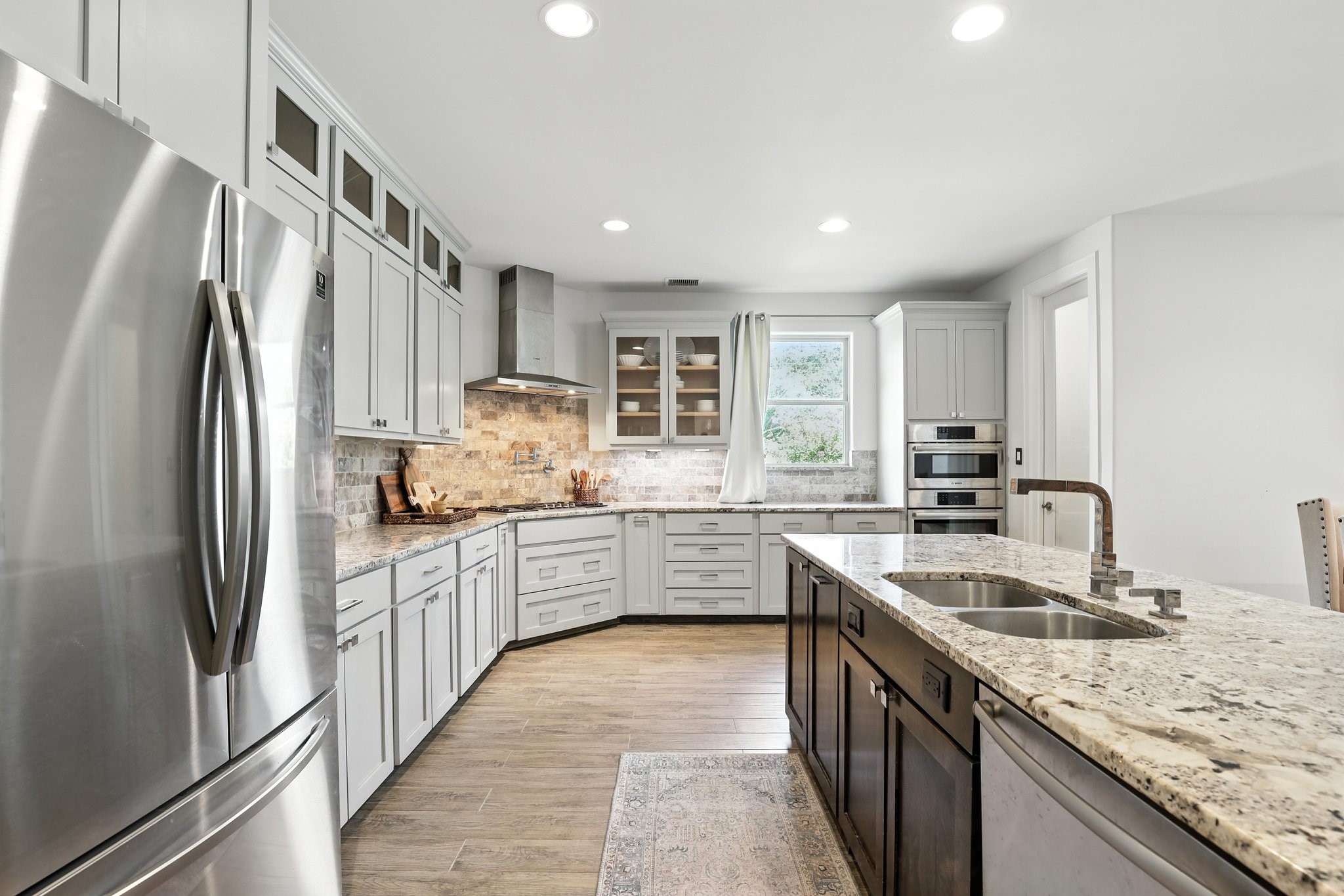 3202 Ozark Street Houston, TX 77021 - Photo 16 of 37 a kitchen with granite countertop a sink stainless steel appliances and cabinets