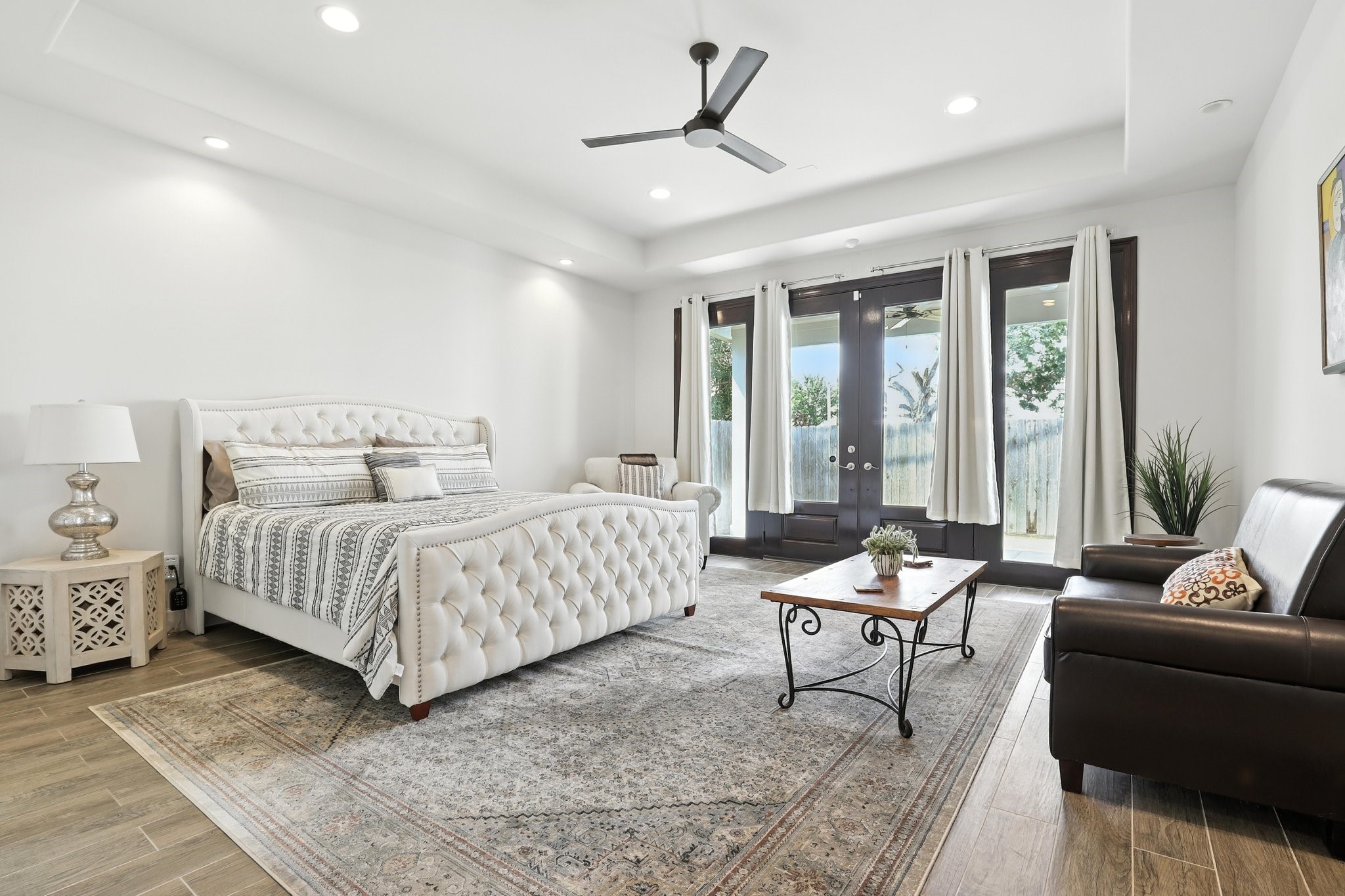 3202 Ozark Street Houston, TX 77021 - Photo 19 of 37 a bedroom with a bed and wooden floor