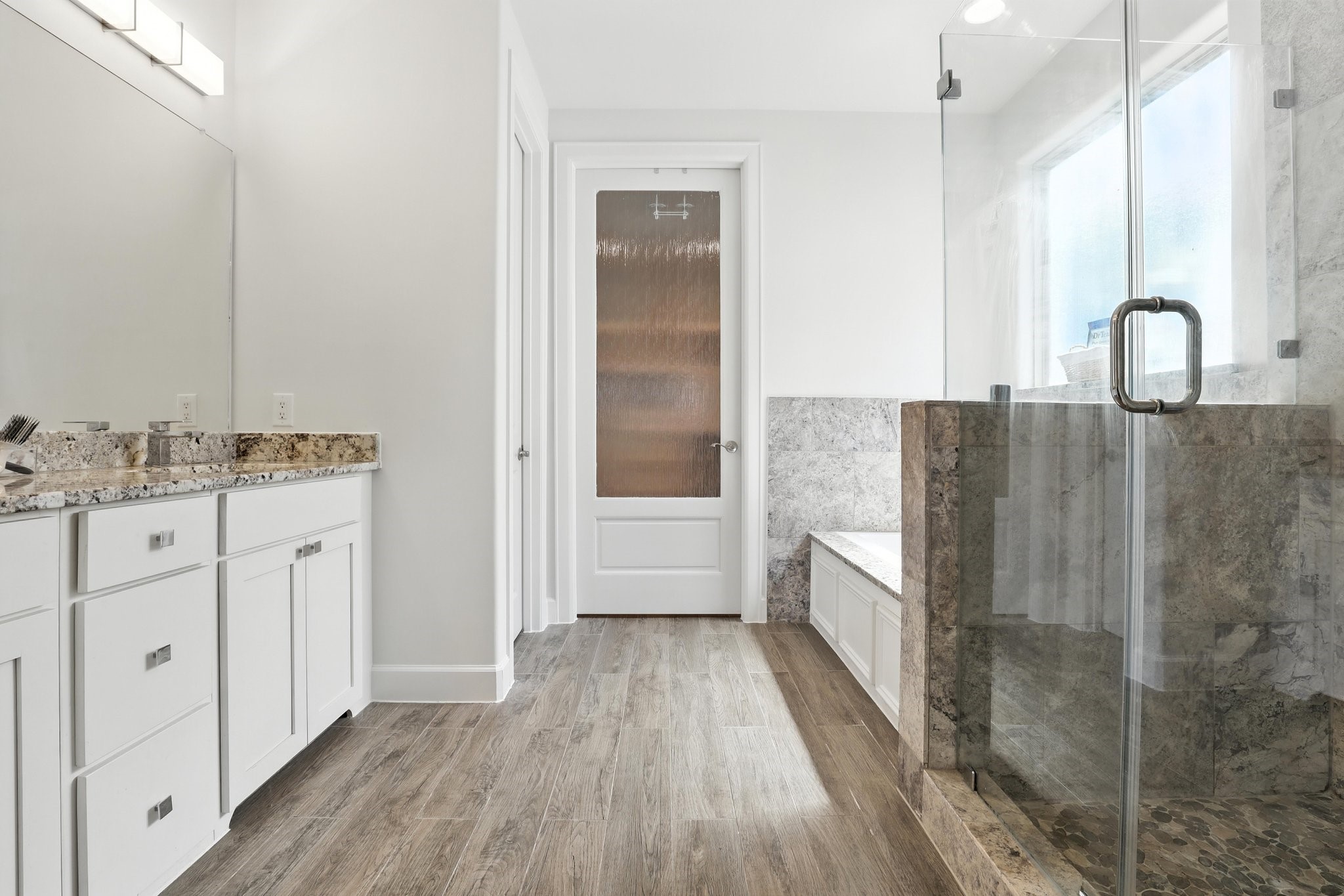 3202 Ozark Street Houston, TX 77021 - Photo 21 of 37 a bathroom with a double vanity sink and mirror