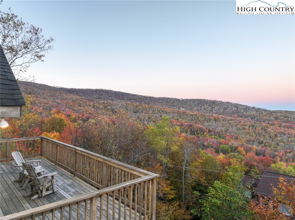 309 Pinnacle Ridge Road Beech Mountain, NC 28604 - Photo 32 of 45 a view of a balcony with wooden fence and floor
