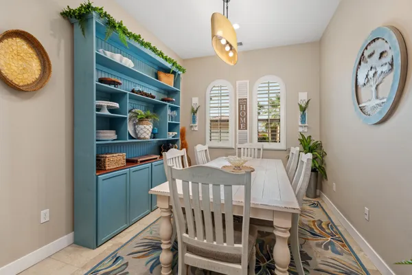 a view of a dining area with furniture and a chandelier