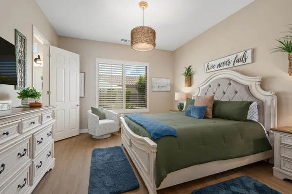 a bedroom with bed and window