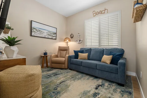 a living room with furniture and a large window