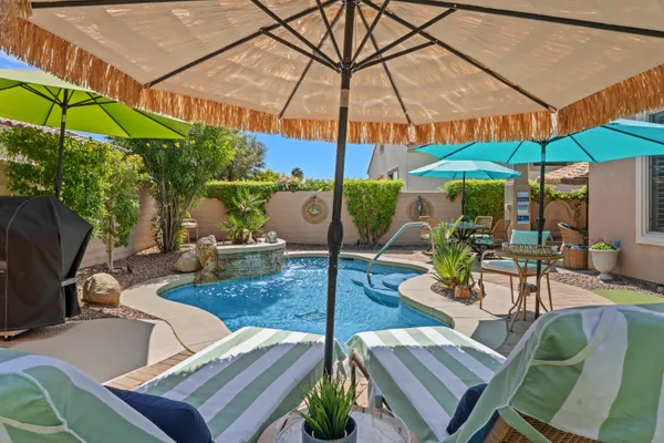 a view of an outdoor sitting area with furniture